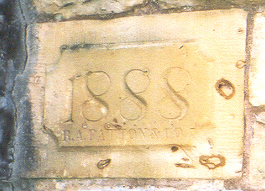 Engraved stone reading "1888"