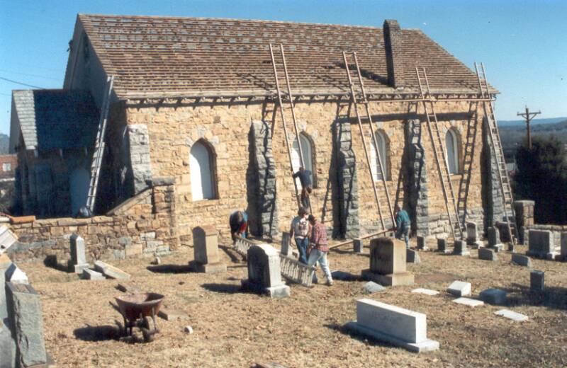 Roofers removing old roof