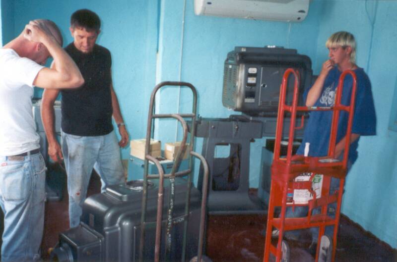 Volunteers in August 2001 unloading used projector equipment